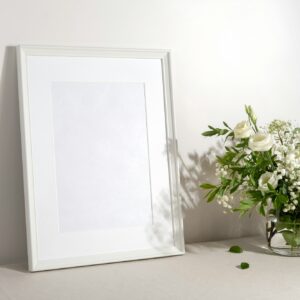 Blank frame mockup for artwork or print on white wall background.