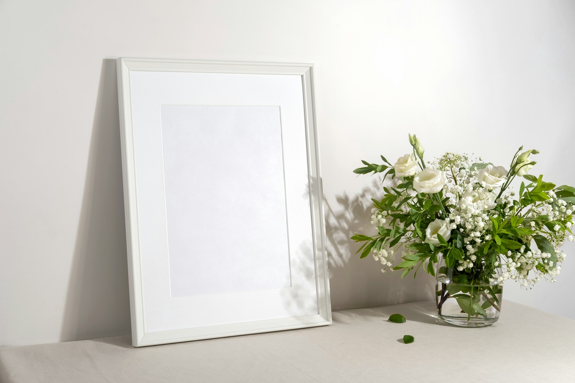 Blank frame mockup for artwork or print on white wall background.